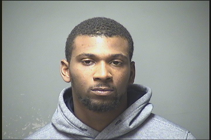 Manchester: Police arrested a Dorchester, Mass. man Sunday evening on an illegal gun charge when he crashed his car on Merrimack Street after a brief chase.