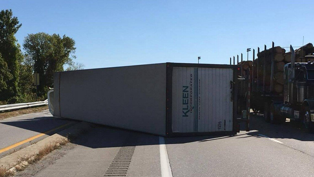 Part of Interstate 293 was closed Wednesday afternoon after a tractor-trailer rolled over, causing a huge mess. Officials said the truck lost control while crossing the Granite Street bridge