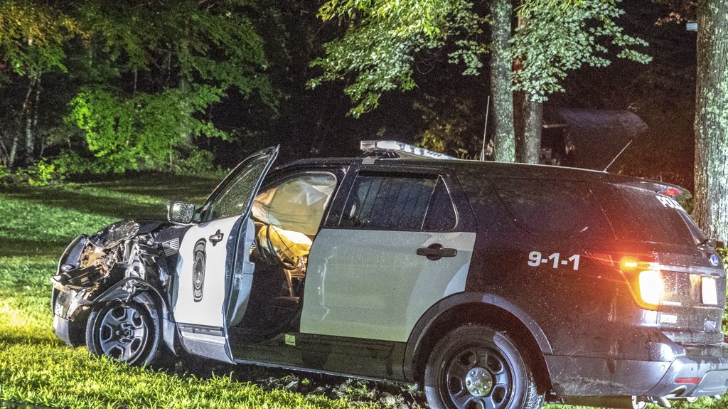Two Raymond police officers were sent to the hospital with likely minor injuries after their SUV police cruisers collided Tuesday night
